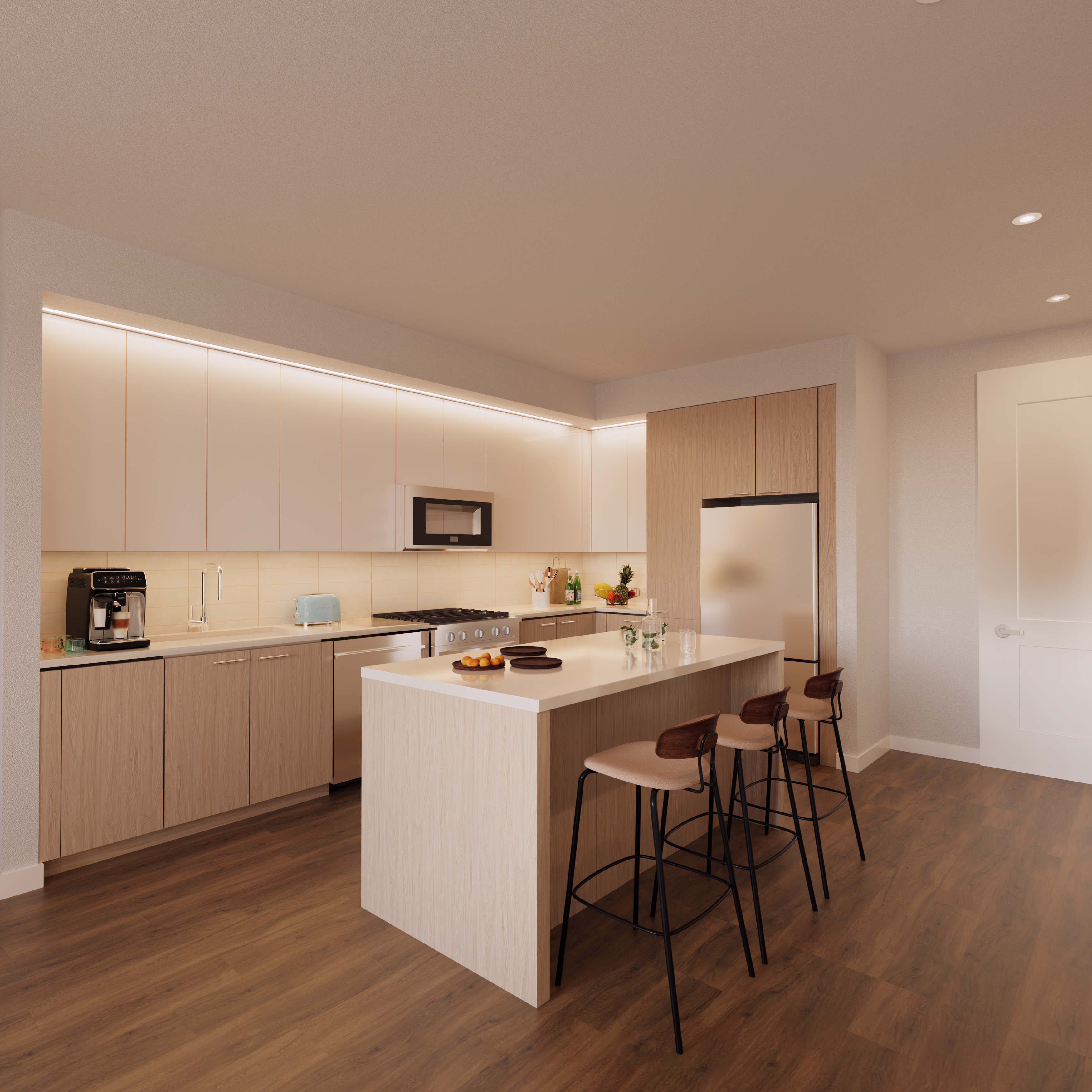 There is an interior of a kitchen with kitchen appliances, an island, and barstools.