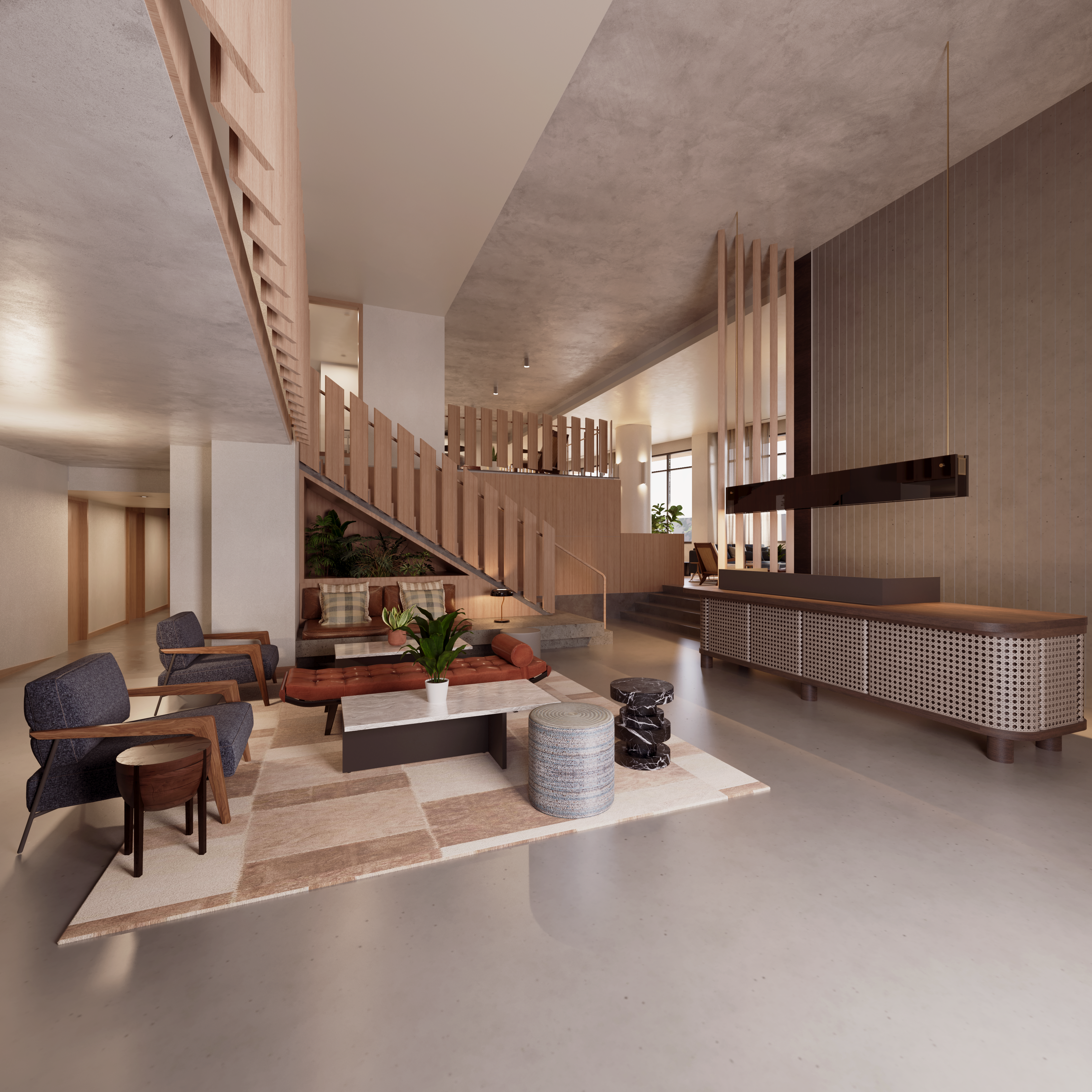 There is a lobby area with chairs and couches. There is a staircase next to the lobby.