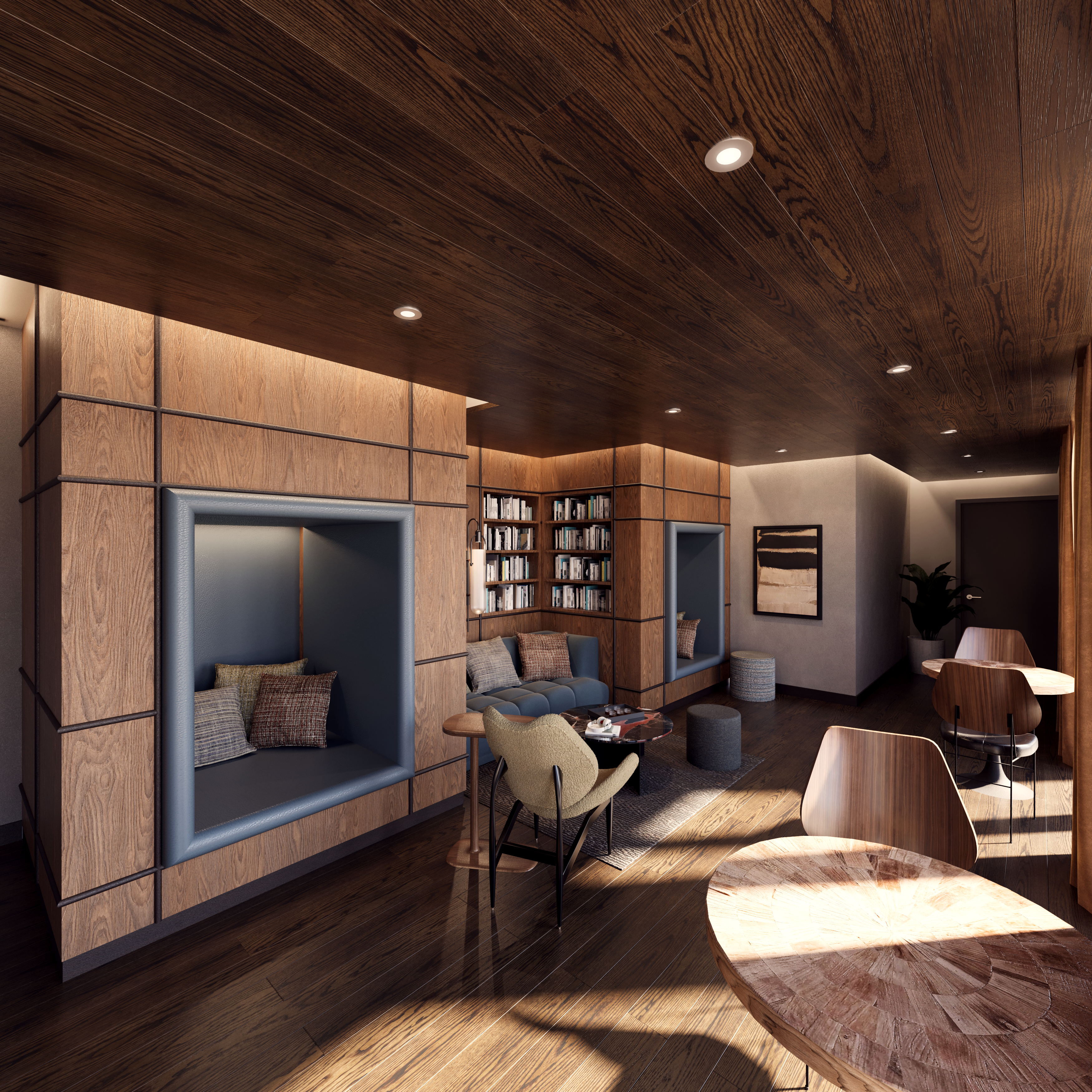 The interior of a lounge area with tables and chairs and a small nook for sitting.