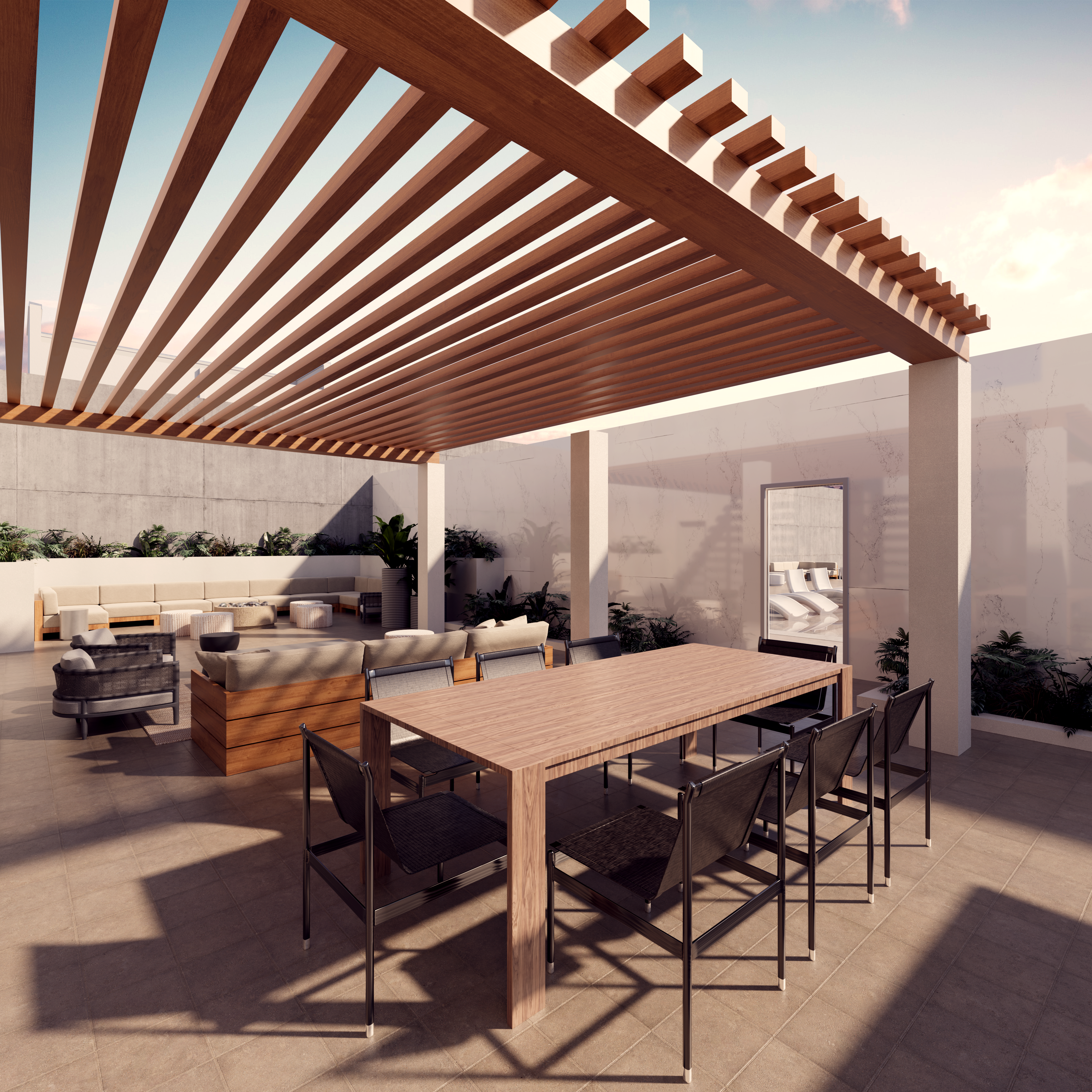 There is a deck with couches and tables with a cabana overtop.